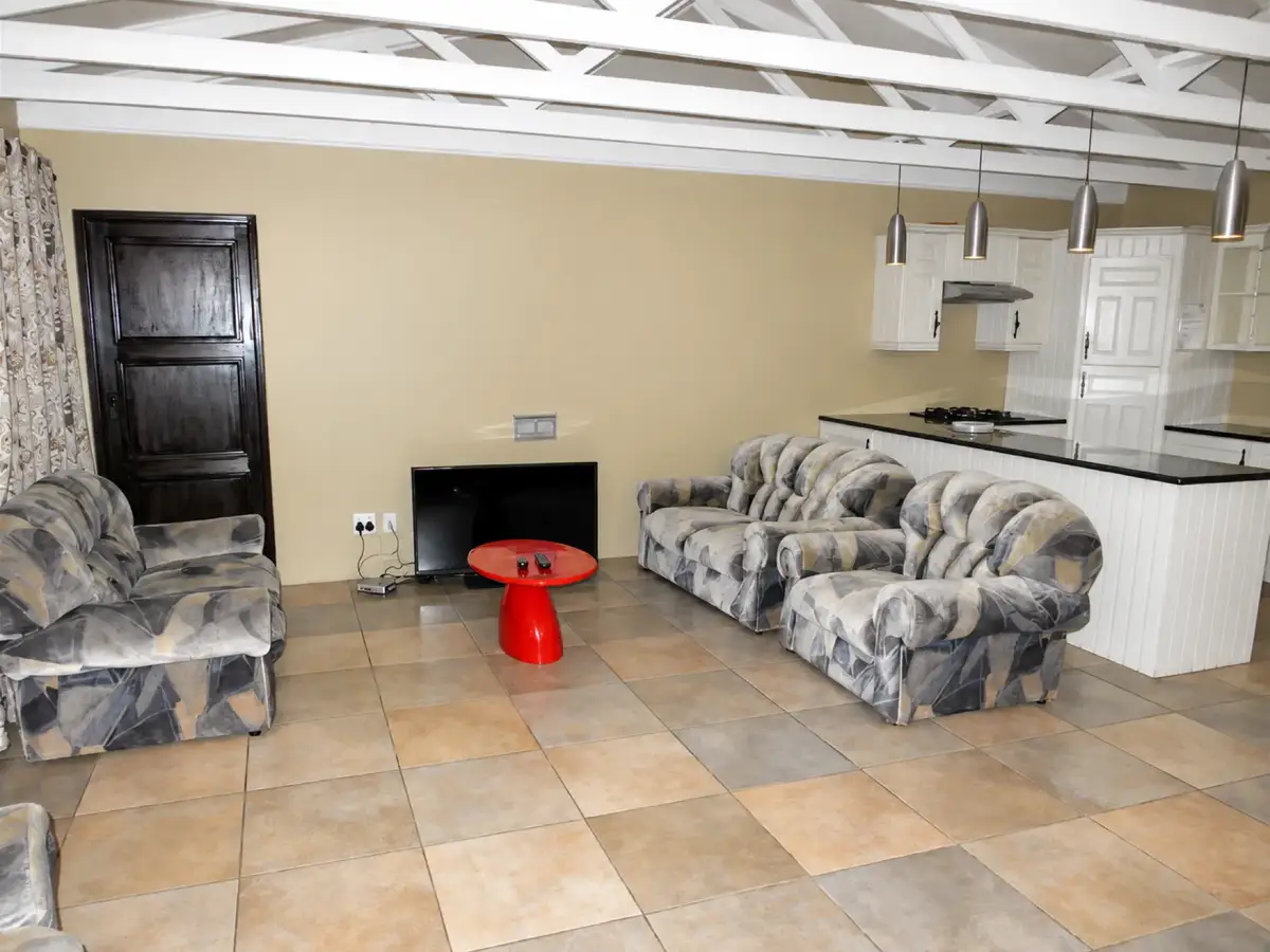 Shared lounge with seating and open kitchen