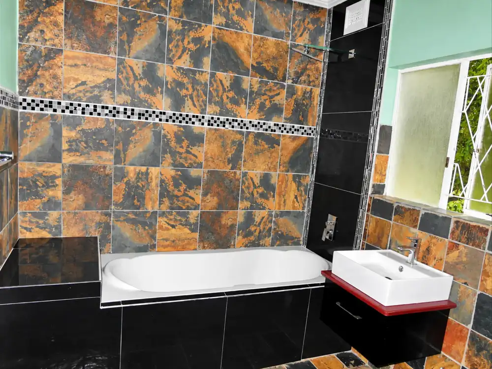 Private bathroom with bath, shower and basin